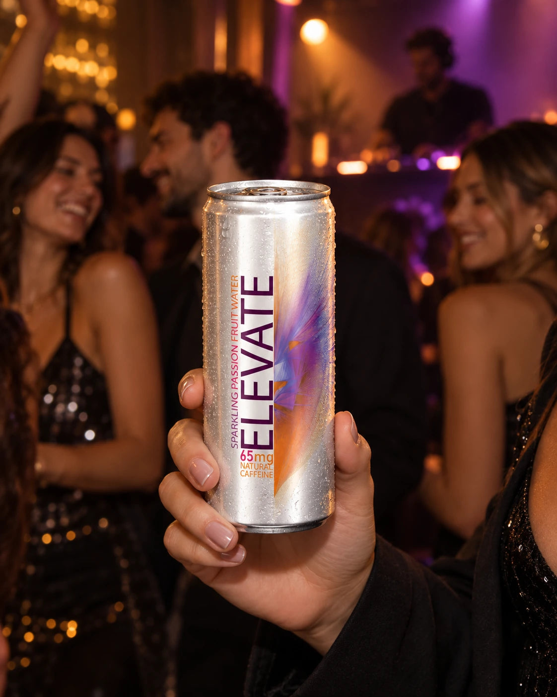An adult holding Elevate Passion Fruit at a music venue with friends
