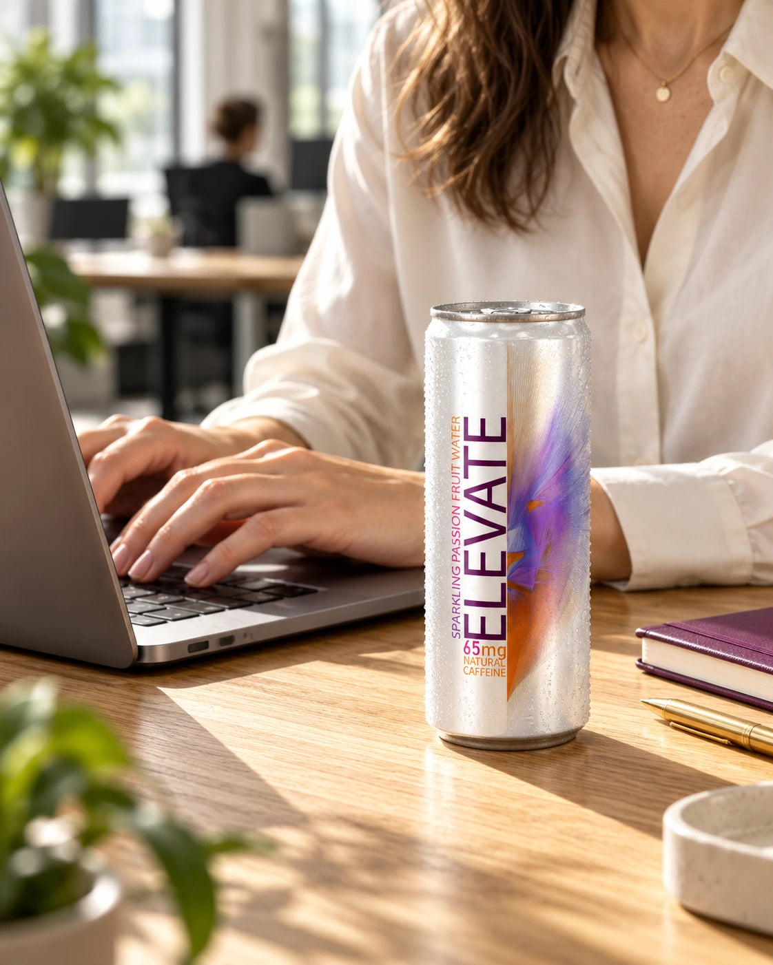 Elevate Passion Fruit beside a laptop during an adult professional’s workday