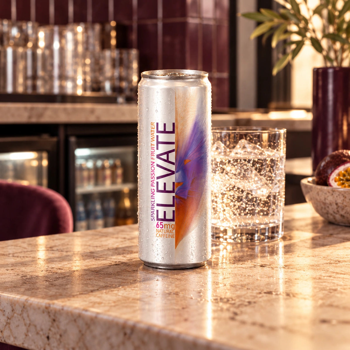 Chilled Elevate Passion Fruit on a contemporary cafe counter, with sparkling water and a hospitality setting